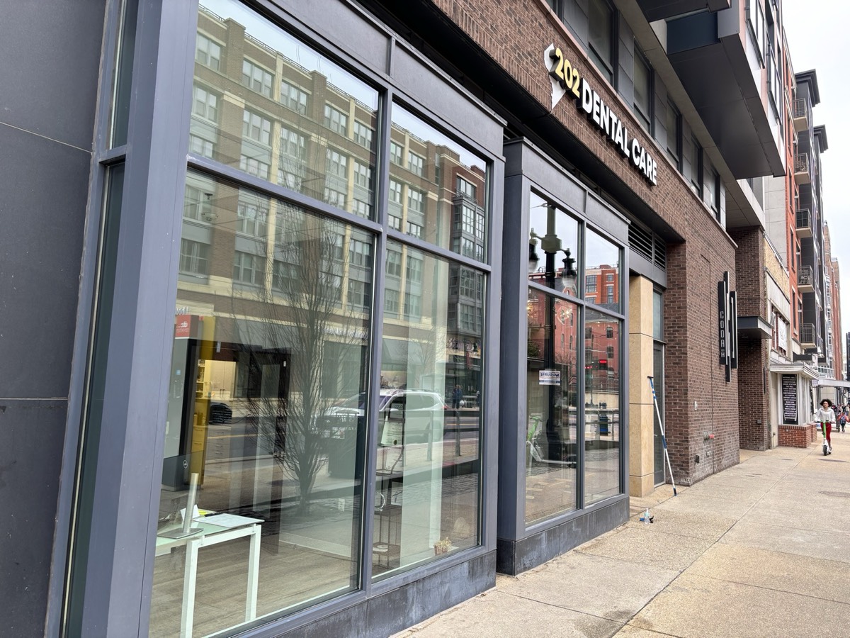 Commercial storefront windows cleaned by WindowBuddy at a downtown dental office